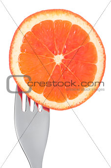 fresh grapefruit slice on a fork isolated