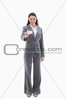 Businesswoman smiling showing a card