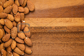 roasted almonds on wooden table