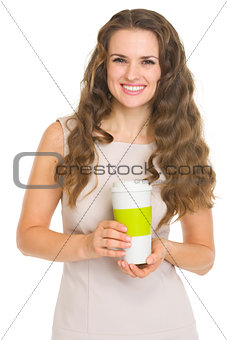 Smiling young woman with coffee cup