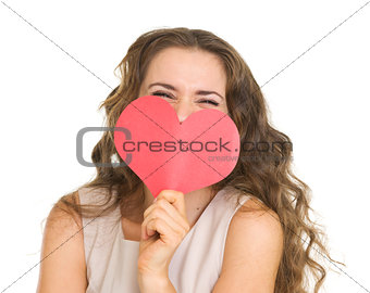 Young woman hiding valentine's day cards