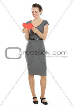 Full length portrait of modern woman reading heart shaped postca