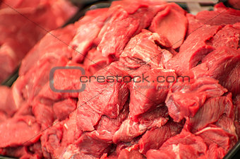 raw fresh meat on shelf in supermarket