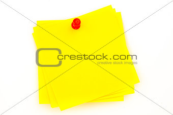 Sticky note with red pushpin