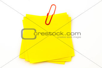 Sticky note with red paperclip