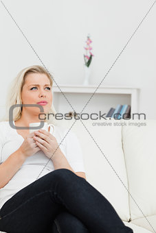 Woman with a cup of coffee in her hands