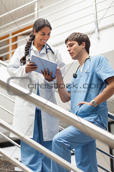 Doctor showing a tablet pc to a nurse