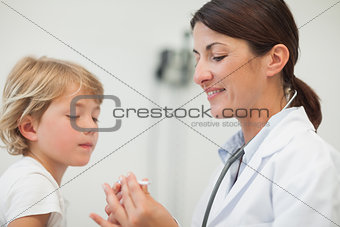 Doctor looking at the thermometer