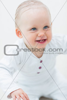Smiling baby looking up
