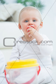 Baby putting a toy in his mouth
