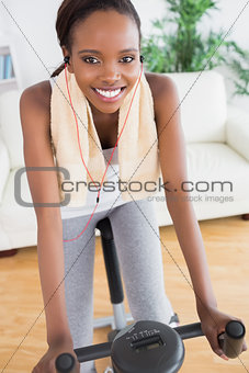 Black woman doing sport while listening music