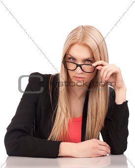 Business woman looking at you over glasses