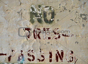 no trespassing peeling sign