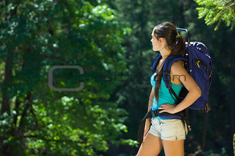 Young woman hiking in summer