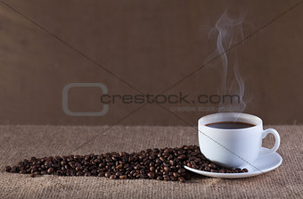 Cup of hot steaming coffee