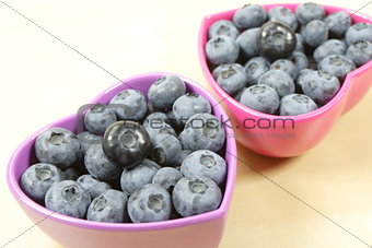 blueberries in violet bowls