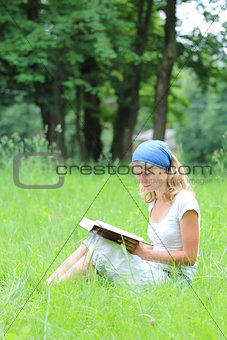 young girl reads the Bible