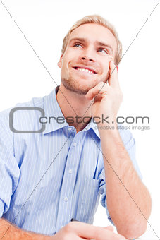 young man at office daydreaming