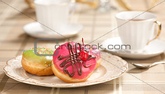 tea cup and doughnuts