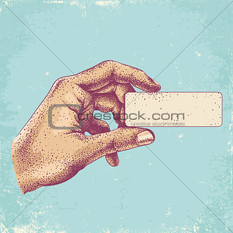 hand holding a business card