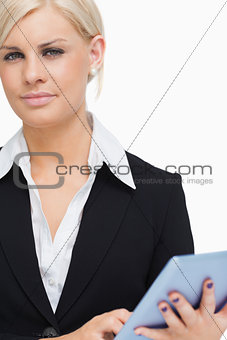 Green eyed businesswoman holding a tablet