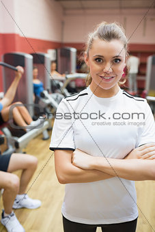 Female trainer in weights room