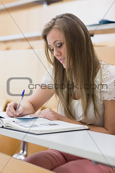 Focused student sitting at the lecture hall
