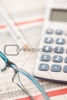 Shot of calculator and glasses