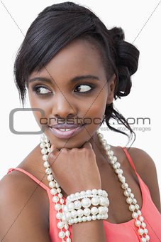 Smiling woman with pearl necklace and bracelet