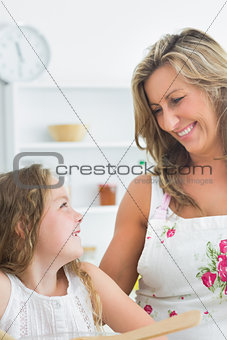 Mother smiling at her daughter