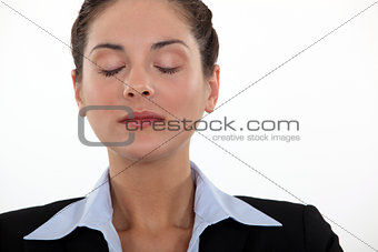 Businesswoman with her eyes closed