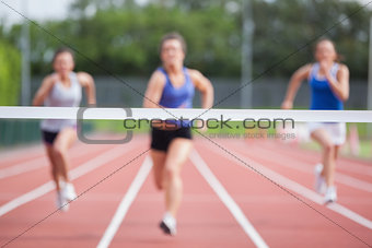Athletes racing towards finish line