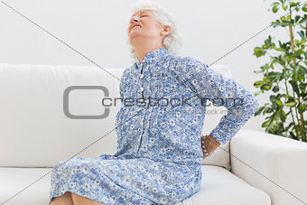 Elderly woman feeling back pain