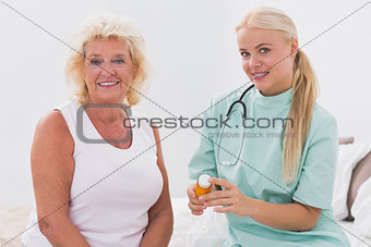 Home nurse and patient posing