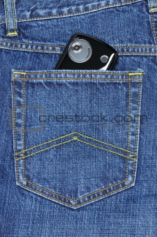 pda phone in blue jeans pocket