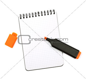 Orange marker on notepad