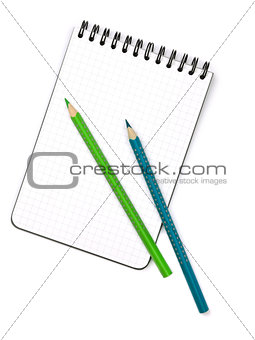 Two color pencils on notepad