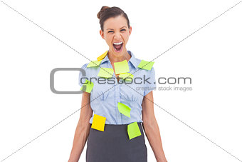 Businesswoman covered with sticky notes