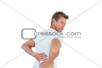 Handsome man suffering from back pain