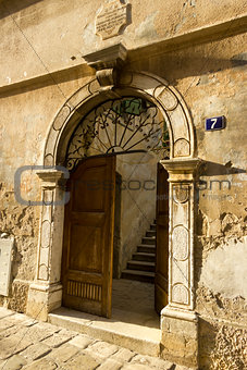Ancient door on the street in Porec, Croatia