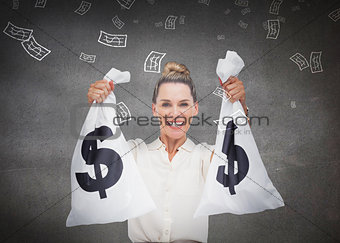 Businesswoman holding cash bags