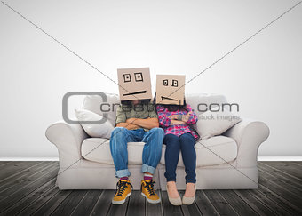 Couple wearing humorous boxes on their head