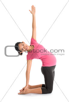 Asian pregnant yoga position.