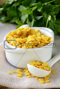 yellow lentils in a bowl on the table