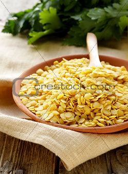 yellow lentils in a bowl on the table