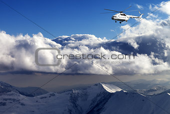 Helicopter in winter mountains