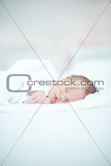 Newborn Baby Laying on White Bed