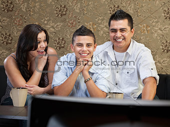 Hispanic Family Enjoying TV