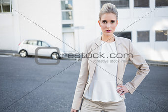 Serious stylish businesswoman posing