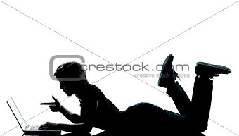 one young teenager boy  girl silhouette computer computing lapto